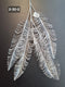 Ramură artificială decorativă argintie tip palmier - 85cm