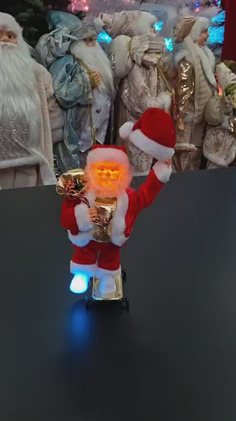 Moș Crăciun pe skateboard cu baterii, decor - 25cm