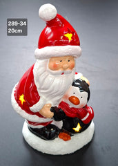 Figurină Moș Crăciun cu pinguin, decor ceramic Crăciun - 20cm