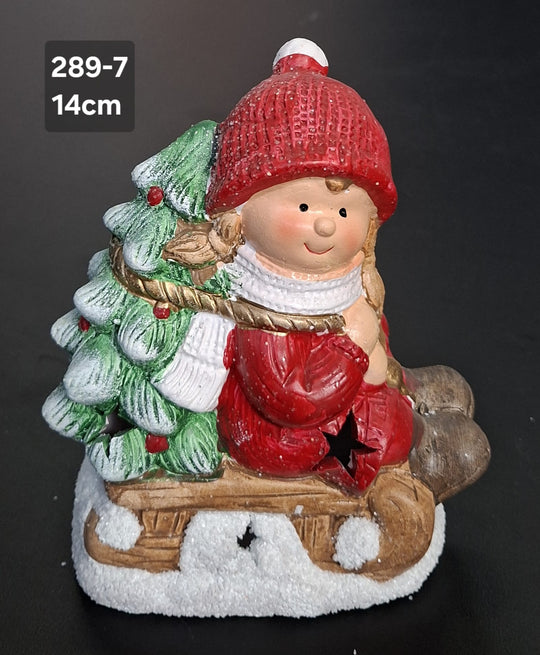 Decor ceramic Crăciun copil cu brăduț pe sanie LED - 14cm