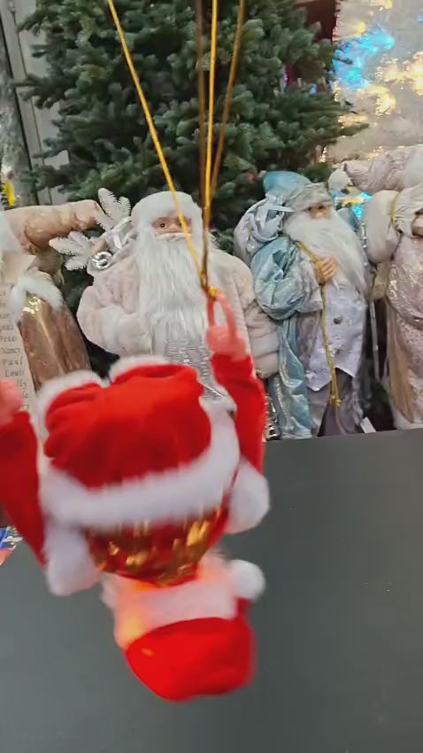 Moș Crăciun pe scară, decor animat cu baterii - 25cm
